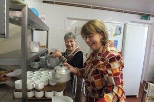 two people making refreshments after Sunday's Morning Service